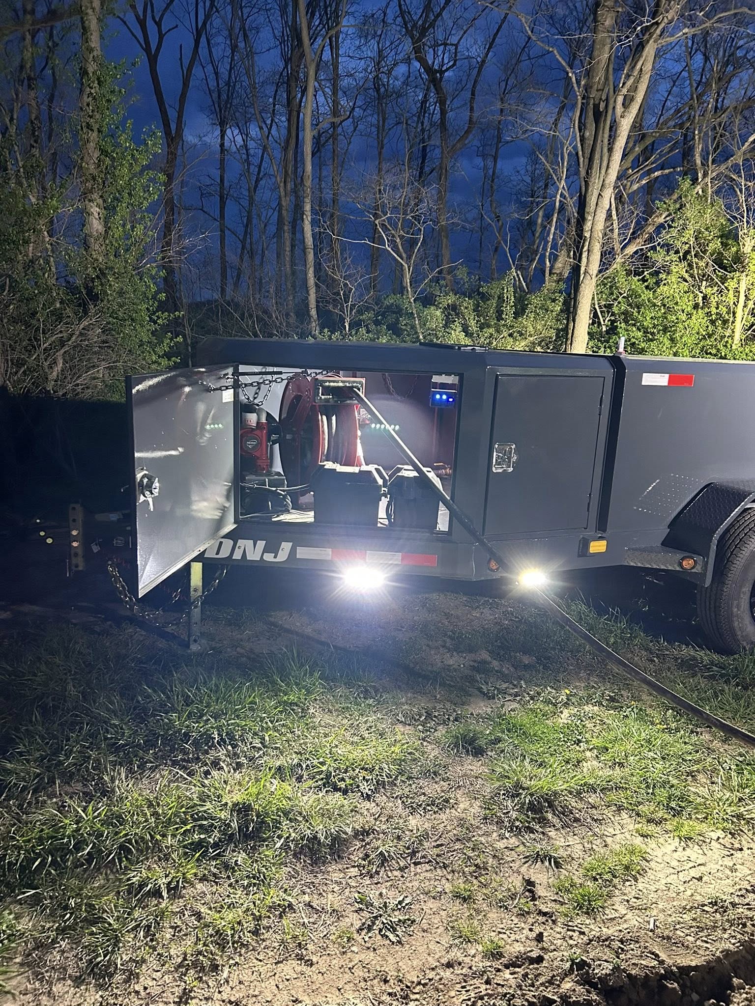 Deluxe fuel trailers with lights on at night